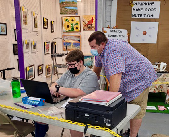 Image of Volunteers helping at previous Fairs